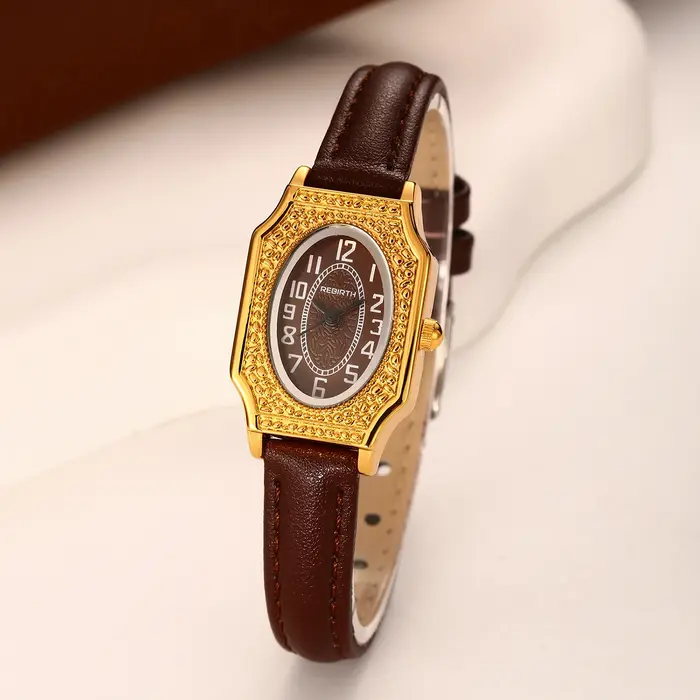 Montre à quartz simple et rétro pour femme avec un cadran ovale compact et un bracelet en cuir fin pour un usage quotidien