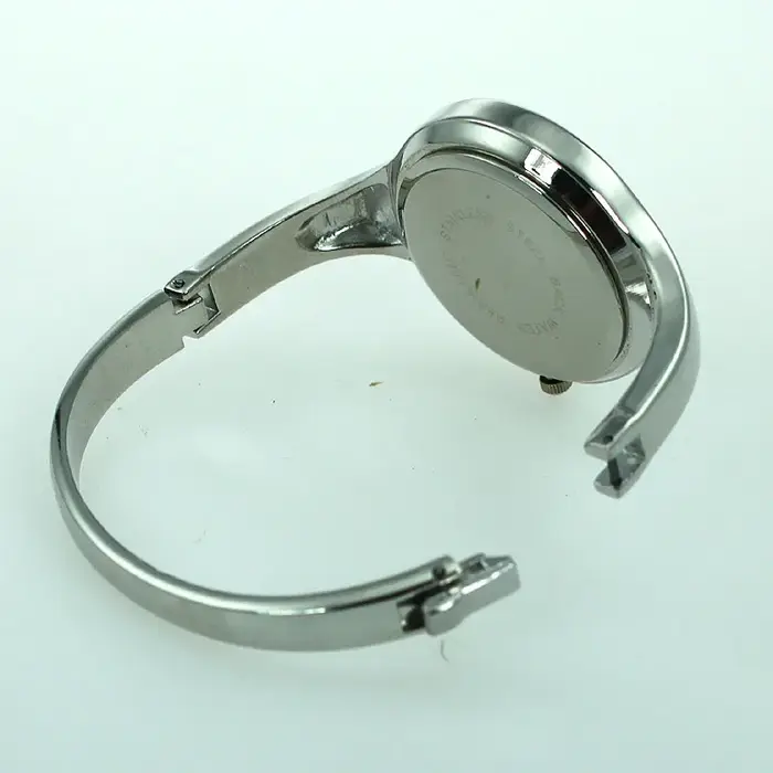 Montre manchette en acier inoxydable doré pour femme