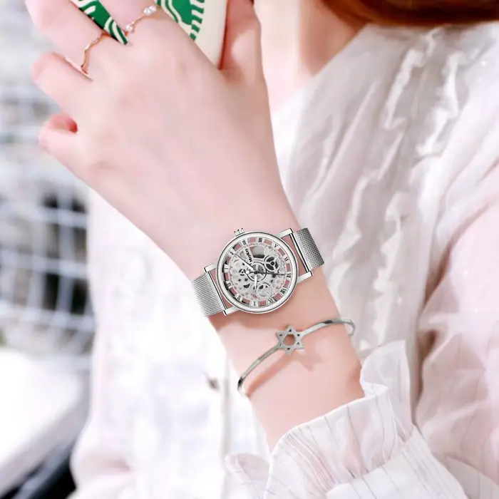 Top nouvelle mode femmes creux squelette Faux montre mécanique dames métal maille Quartz montres pour femme Relogio Feminino